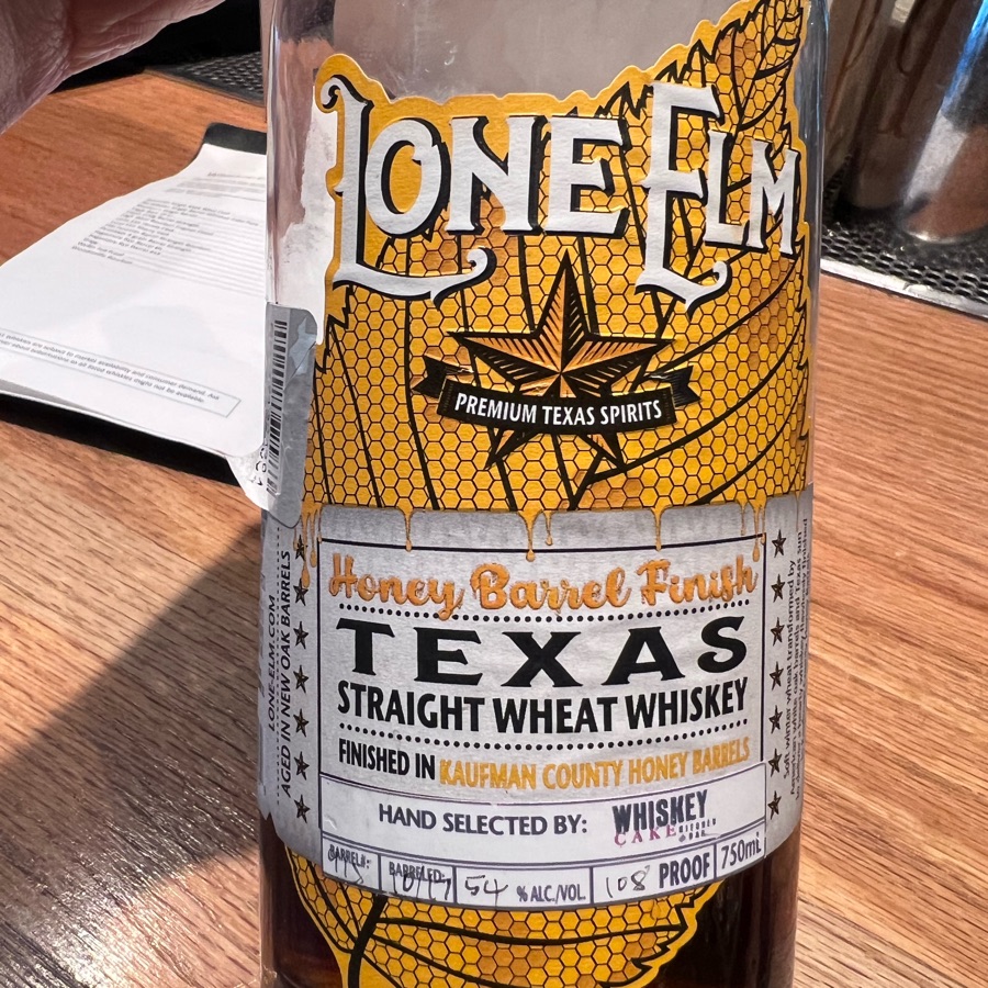 Lone Elm Texas Straight Wheat Whiskey Honey Barrel Finish Finished in Kaufman County Honey Barrels Aged In New Oak Barrels Barreled: 10/17 (Whiskey Cake)